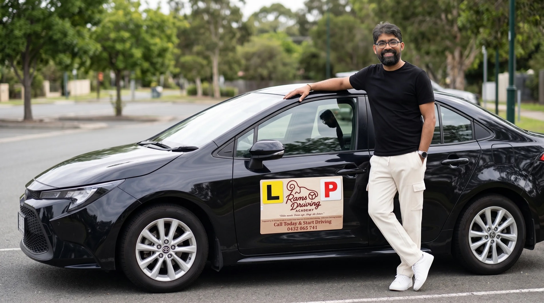 Barani Kumar with the Rams Driving Academy car on an Adelaide street